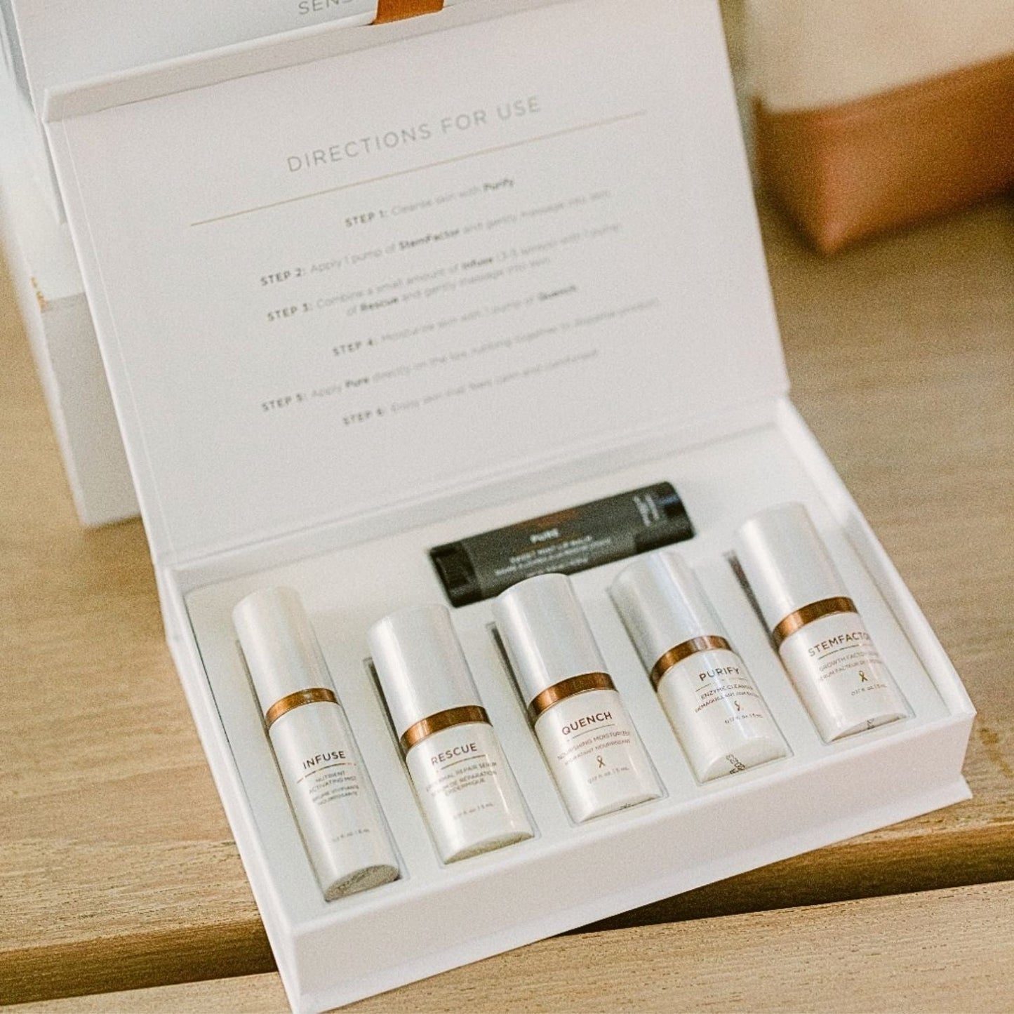 opened box with osmosis products inside on countertop